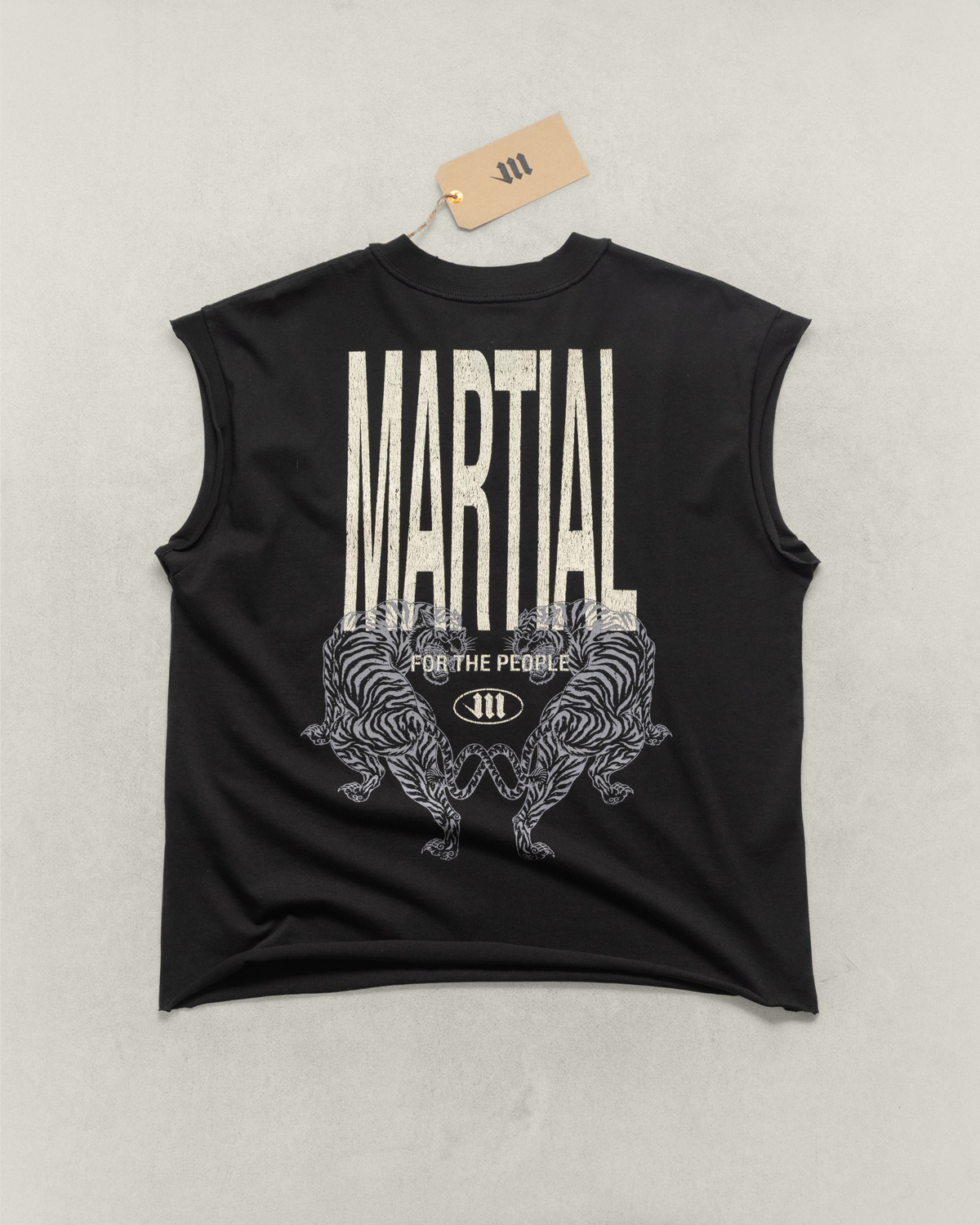 Black sleeveless shirt with 'Martial' text and graphic design on a light gray background